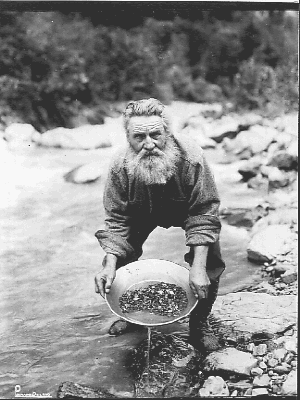 alaska-state-library-photograph-pca-44-3-15-sourdough-in-stream-panning-for-gold-skinner.gif